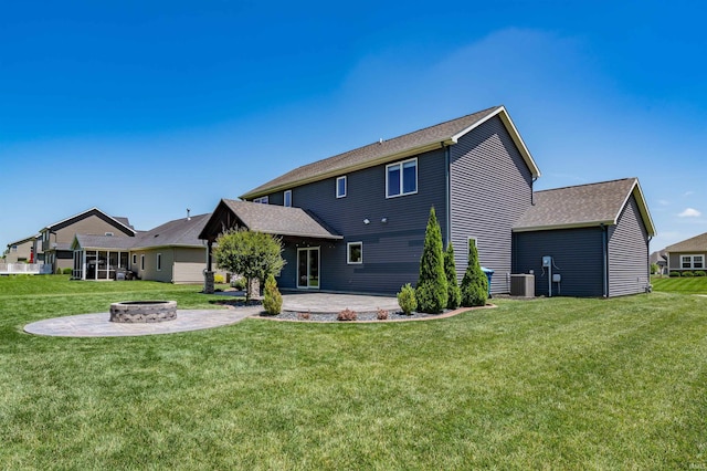 3032 Treviso Way, Fort Wayne, IN 46814 - rear view of property with a fire pit, a patio area, a lawn, and a shingled roof