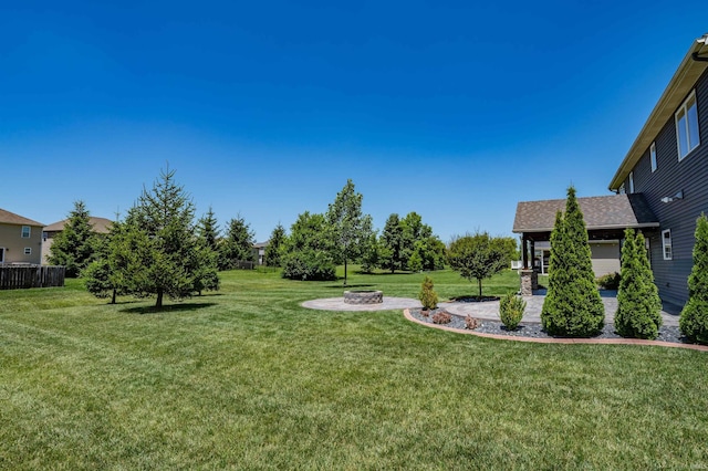 3032 Treviso Way, Fort Wayne, IN 46814 - view of green lawn featuring an outdoor fire pit