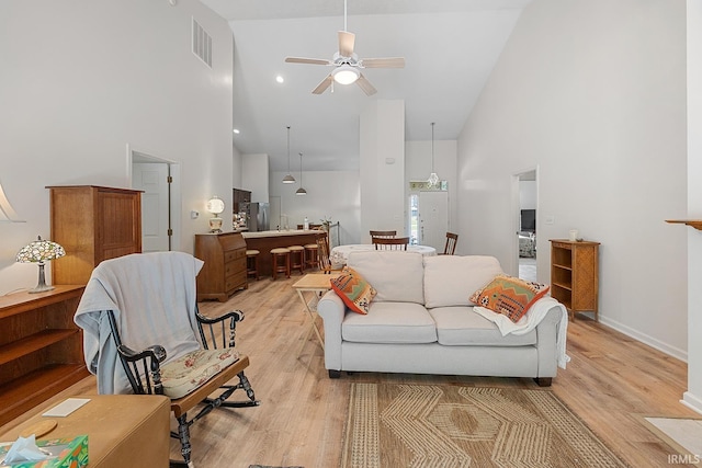 323 E Pine Ave, West Lafayette, IN 47906 - living room with high vaulted ceiling, light wood finished floors, and a ceiling fan