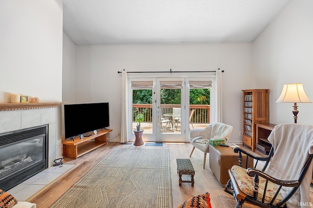 323 E Pine Ave, West Lafayette, IN 47906 - living area featuring light wood-style floors and a tiled fireplace