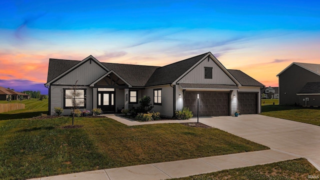 12116 Fazio Dr, Fort Wayne, IN 46818 - modern inspired farmhouse featuring a yard, driveway, a garage, and a shingled roof
