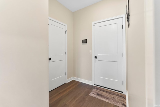 12116 Fazio Dr, Fort Wayne, IN 46818 - doorway with dark wood-style flooring and baseboards