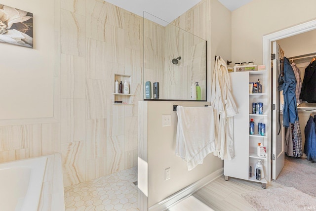 12116 Fazio Dr, Fort Wayne, IN 46818 - bathroom featuring walk in shower, a walk in closet, and a garden tub
