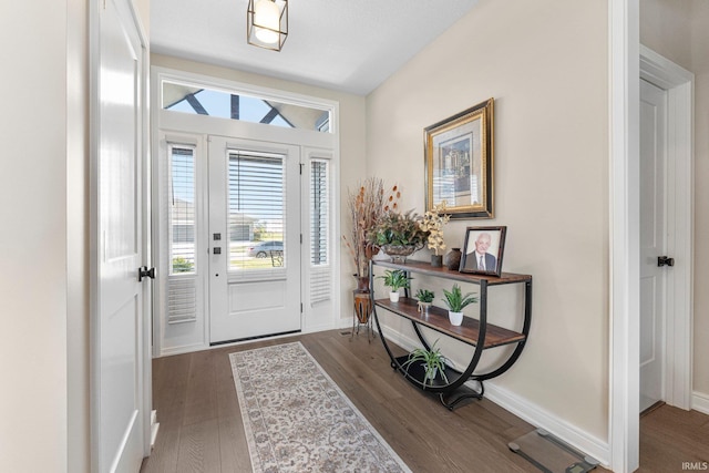 12116 Fazio Dr, Fort Wayne, IN 46818 - entrance foyer with dark wood finished floors and baseboards