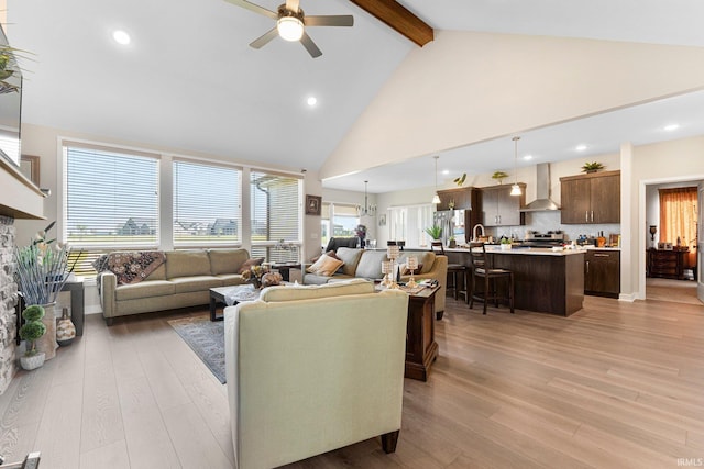 12116 Fazio Dr, Fort Wayne, IN 46818 - living room with high vaulted ceiling, ceiling fan, beamed ceiling, light wood-style flooring, and recessed lighting