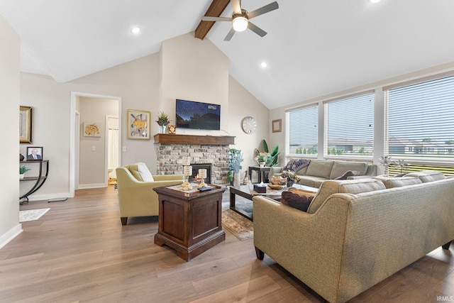 12116 Fazio Dr, Fort Wayne, IN 46818 - living room featuring high vaulted ceiling, a ceiling fan, beam ceiling, a fireplace, and light wood-style flooring