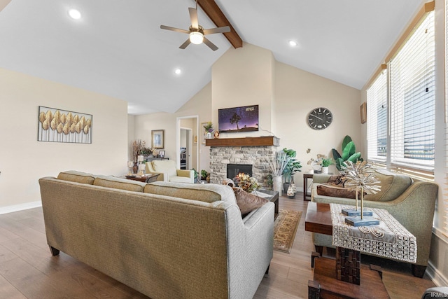 12116 Fazio Dr, Fort Wayne, IN 46818 - living room featuring beam ceiling, a ceiling fan, high vaulted ceiling, a fireplace, and wood finished floors