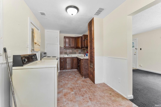 7201 Baer Rd, Fort Wayne, IN 46809 - washroom featuring a textured ceiling and washer and dryer