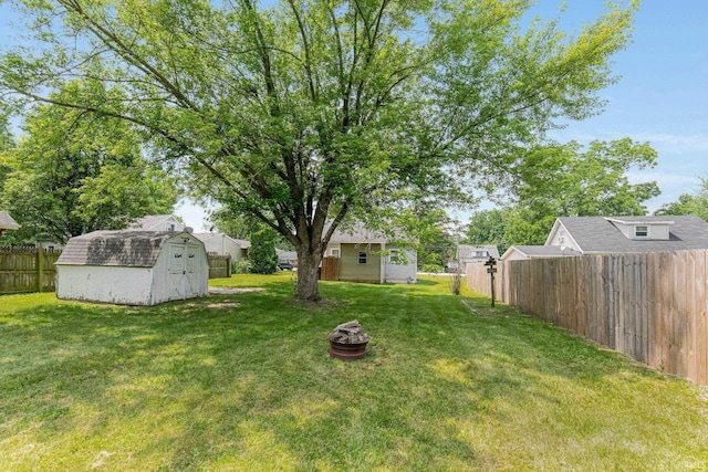 7201 Baer Rd, Fort Wayne, IN 46809 - fenced backyard featuring a storage unit and an outdoor fire pit