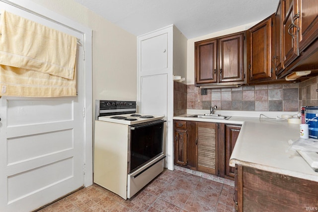 7201 Baer Rd, Fort Wayne, IN 46809 - kitchen with white range with electric stovetop, light countertops, decorative backsplash, and light tile patterned floors