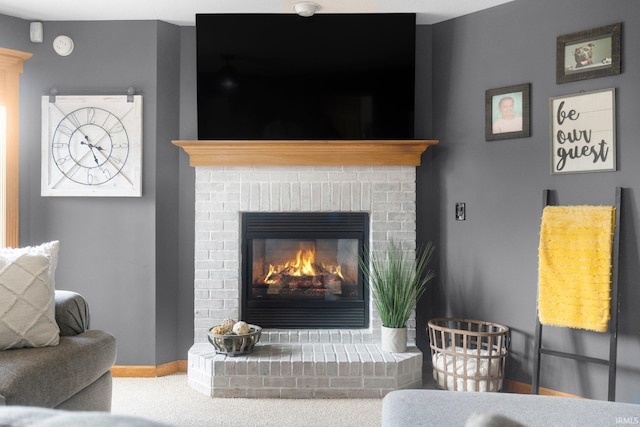 2608 Creeping Phlox Cv, Fort Wayne, IN 46818 - carpeted living room with a brick fireplace and baseboards