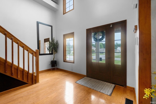 2608 Creeping Phlox Cv, Fort Wayne, IN 46818 - foyer with healthy amount of natural light, wood finished floors, stairs, and a high ceiling