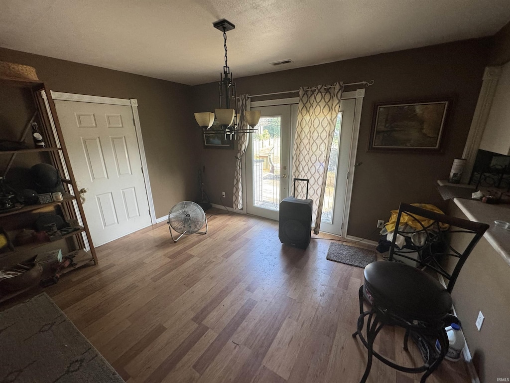 9924 Washington St, Leo, IN 46765 - dining area with wood finished floors and a chandelier