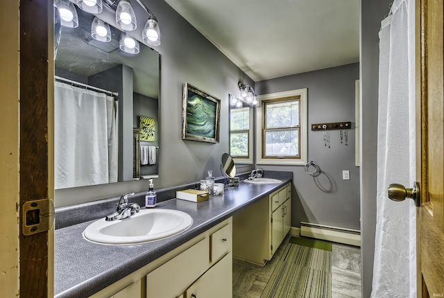 420 E Cedar Canyons Rd, Huntertown, IN 46748 - full bathroom featuring a baseboard radiator and double vanity