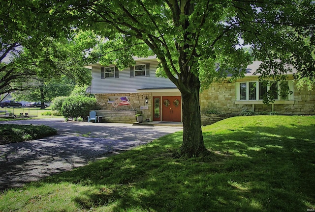 420 E Cedar Canyons Rd, Huntertown, IN 46748 - view of front facade featuring stone siding and a front lawn
