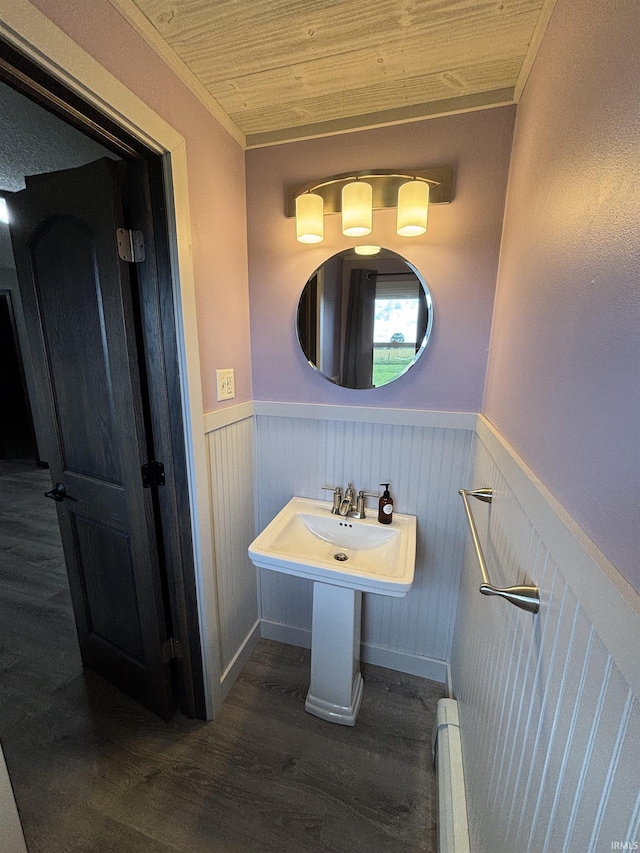 140 W 100 S Rd, Lagrange, IN 46761 - bathroom with wainscoting, wood finished floors, a baseboard heating unit, ornamental molding, and wood ceiling