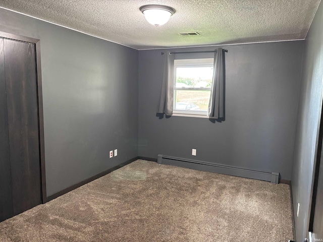 140 W 100 S Rd, Lagrange, IN 46761 - unfurnished room with baseboard heating, a textured ceiling, and carpet