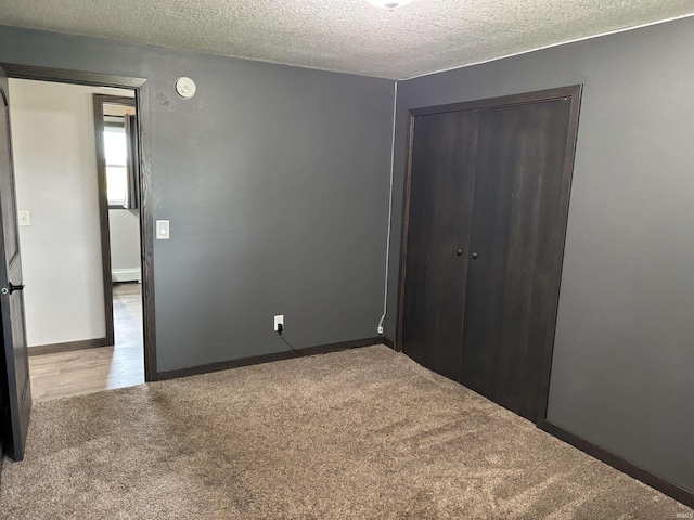 140 W 100 S Rd, Lagrange, IN 46761 - unfurnished bedroom featuring carpet, a textured ceiling, and a closet