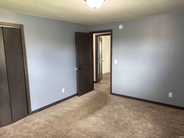 140 W 100 S Rd, Lagrange, IN 46761 - unfurnished bedroom with carpet flooring, a closet, and a textured ceiling