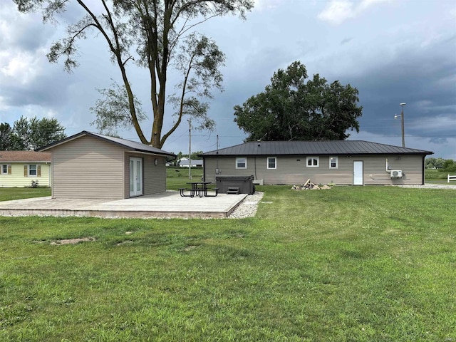 140 W 100 S Rd, Lagrange, IN 46761 - rear view of house featuring a hot tub, a wooden deck, and a yard