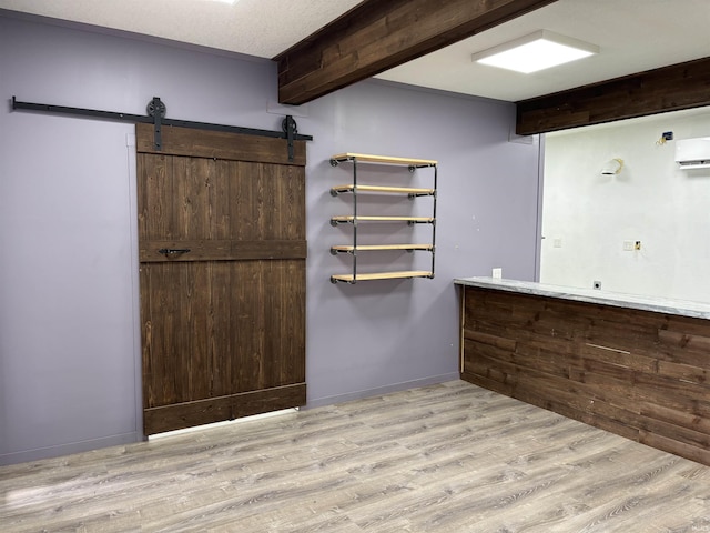 140 W 100 S Rd, Lagrange, IN 46761 - bar with light wood-style flooring, a wall mounted AC, and a barn door