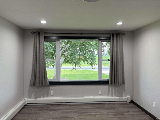 140 W 100 S Rd, Lagrange, IN 46761 - unfurnished room with a baseboard radiator, wood finished floors, recessed lighting, and a baseboard heating unit