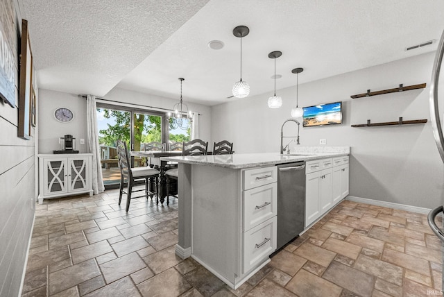 2624 E Stalf Rd, Columbia City, IN 46725 - kitchen featuring dishwasher, stone tile floors, a peninsula, white cabinetry, and a textured ceiling