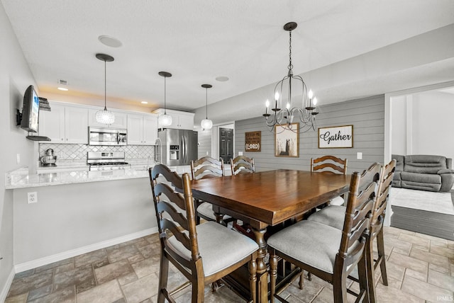 2624 E Stalf Rd, Columbia City, IN 46725 - dining space featuring stone finish flooring and a chandelier