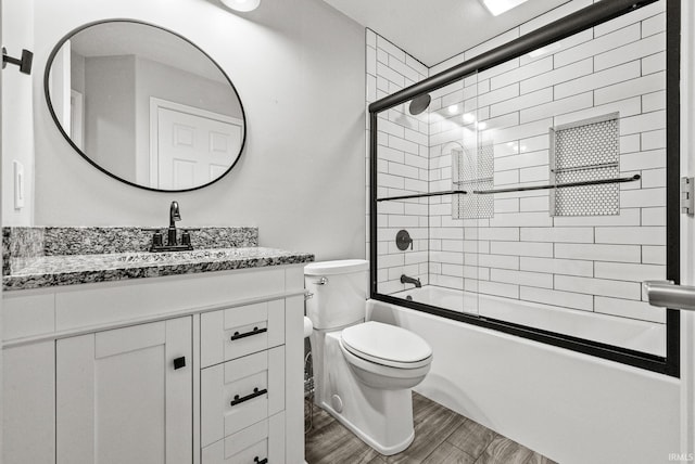 2624 E Stalf Rd, Columbia City, IN 46725 - full bathroom featuring vanity, bath / shower combo with glass door, and wood finished floors