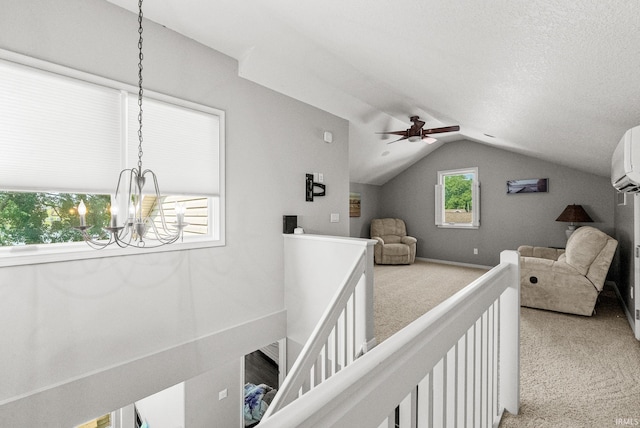 2624 E Stalf Rd, Columbia City, IN 46725 - bedroom featuring light carpet, a chandelier, lofted ceiling, and a ceiling fan