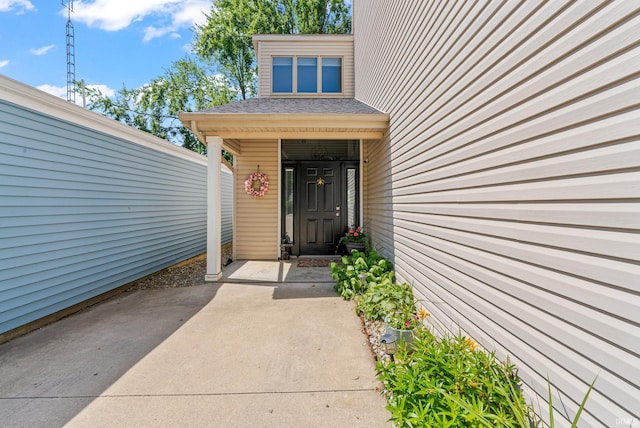 2624 E Stalf Rd, Columbia City, IN 46725 - doorway to property featuring roof with shingles