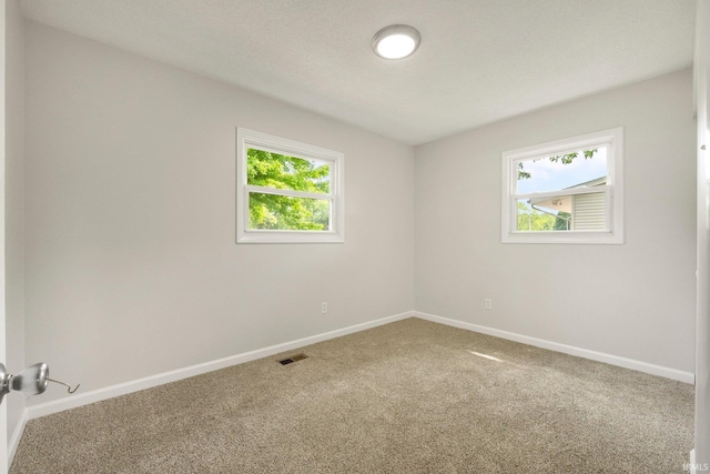 5116 Rebecca St, Fort Wayne, IN 46835 - spare room featuring carpet floors and baseboards