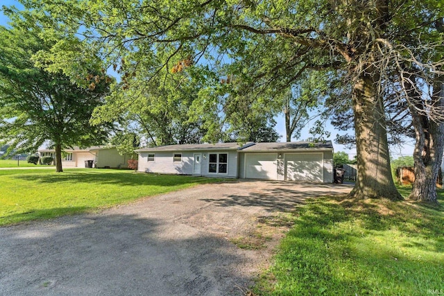 5116 Rebecca St, Fort Wayne, IN 46835 - ranch-style home featuring dirt driveway, a garage, and a front yard