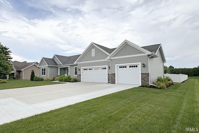 67320 Brentwood Dr, Goshen, IN 46526 - craftsman-style home featuring an attached garage, concrete driveway, and stone siding
