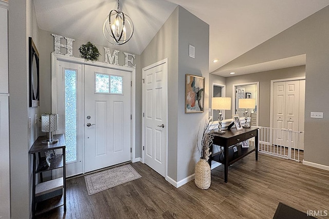 67320 Brentwood Dr, Goshen, IN 46526 - entryway featuring lofted ceiling, a chandelier, and dark wood-type flooring