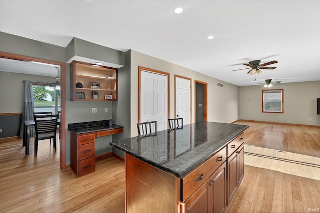 20860 Wyngate Court 20860Wyngate Ct S Bend, In 46614-5178, South Bend, IN 46614 - kitchen with ceiling fan, light wood-type flooring, a kitchen island, open floor plan, and dark stone counters