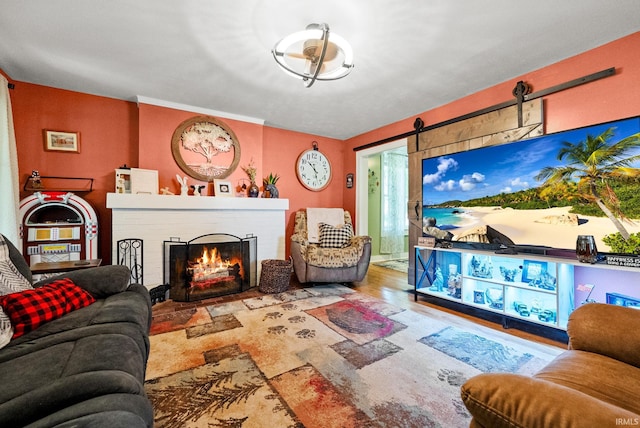 321 W Michigan St, New Carlisle, IN 46552 - living area featuring a barn door and a fireplace