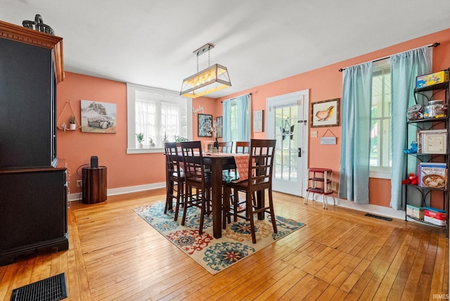 321 W Michigan St, New Carlisle, IN 46552 - dining space featuring light wood-style floors and baseboards