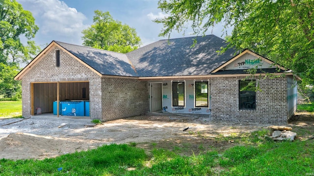 4285 N Elm St, Richland, IN 47634 - property in mid-construction featuring brick siding, covered porch, and a garage