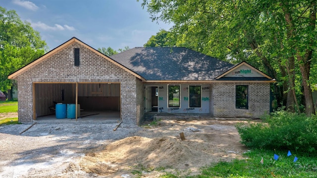 4285 N Elm St, Richland, IN 47634 - property under construction with brick siding, an attached garage, and covered porch