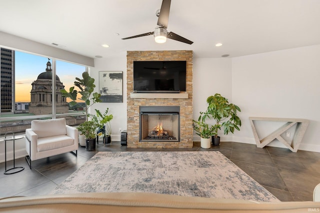 203 E Berry St Unit 1004, Fort Wayne, IN 46802 - tiled living room featuring a stone fireplace, ceiling fan, and recessed lighting