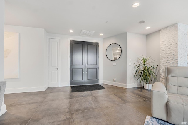 203 E Berry St Unit 1004, Fort Wayne, IN 46802 - entryway featuring recessed lighting and finished concrete flooring