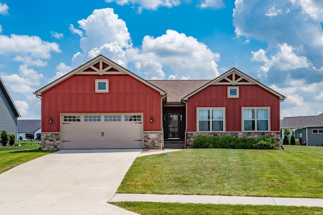 8622 Alamasa Pl, Fort Wayne, IN 46835 - craftsman house featuring board and batten siding, stone siding, a front lawn, and an attached garage