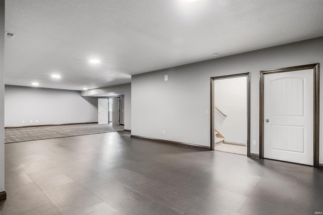 8622 Alamasa Pl, Fort Wayne, IN 46835 - finished basement featuring stairs, recessed lighting, and a textured ceiling