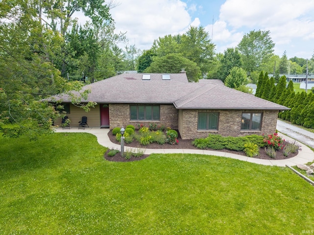 3836 W State Blvd, Fort Wayne, IN 46808 - view of front of house featuring a front yard, brick siding, and a shingled roof