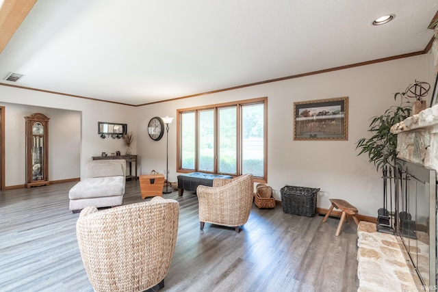 3836 W State Blvd, Fort Wayne, IN 46808 - living area with wood finished floors, a fireplace, ornamental molding, and recessed lighting