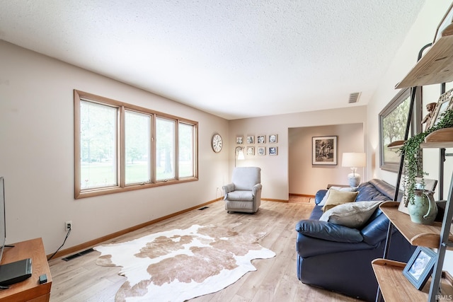 3836 W State Blvd, Fort Wayne, IN 46808 - living room featuring wood-type flooring and a textured ceiling