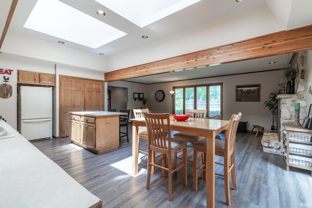 3836 W State Blvd, Fort Wayne, IN 46808 - dining area featuring a skylight, wood finished floors, and recessed lighting