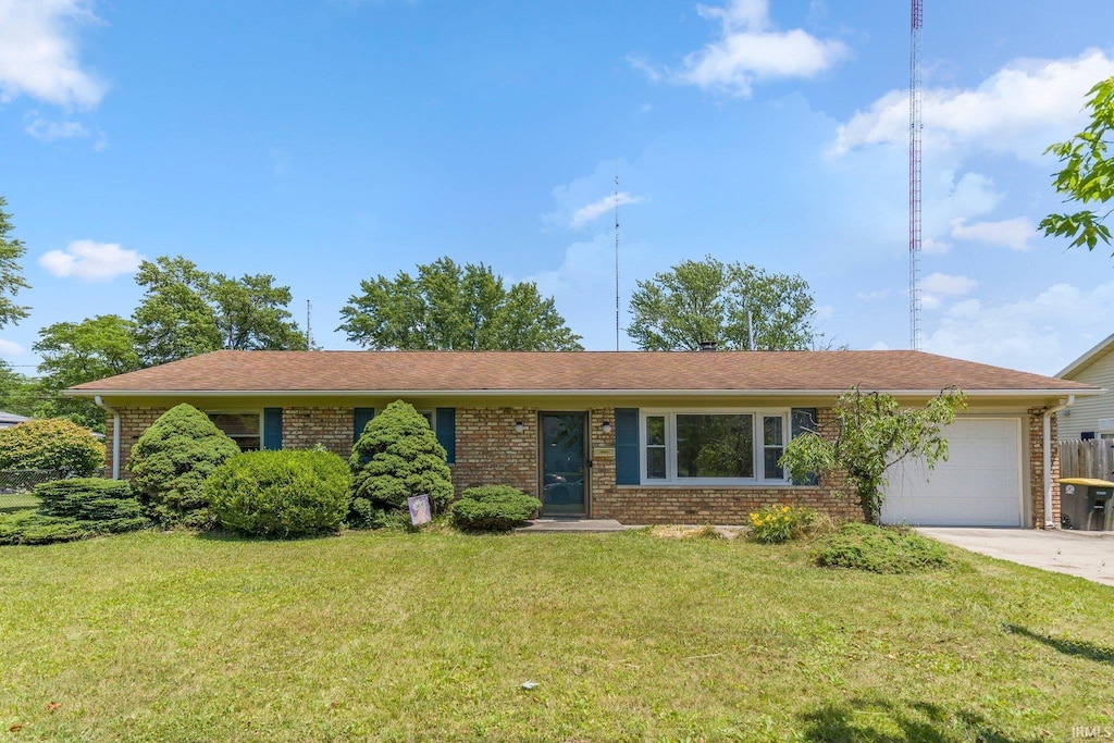 2126 Chochtimar Trl, Fort Wayne, IN 46808 - ranch-style home featuring brick siding, an attached garage, concrete driveway, and a front yard