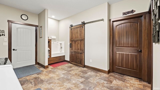 9345 Notestine Rd, Fort Wayne, IN 46835 - foyer featuring stone finish floors and a barn door